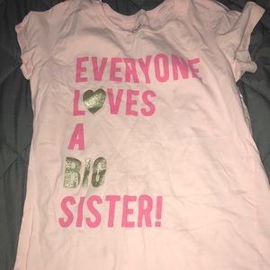 Pink “everyone loves a big sister” tee shirt